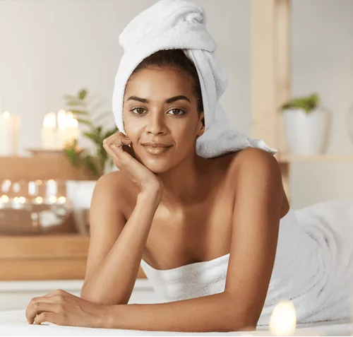 A woman in a towel relaxes