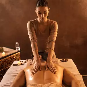 Woman getting a back massage laying face down