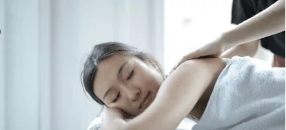 A woman receiving a soothing massage